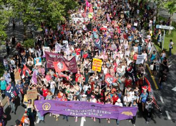 Protesters carry banners and placards at a demonstration during a women's strike (Frauenstreik) in Zurich, Switzerland June 14, 2019. REUTERS/Arnd Wiegmann - RC1D94BC2390